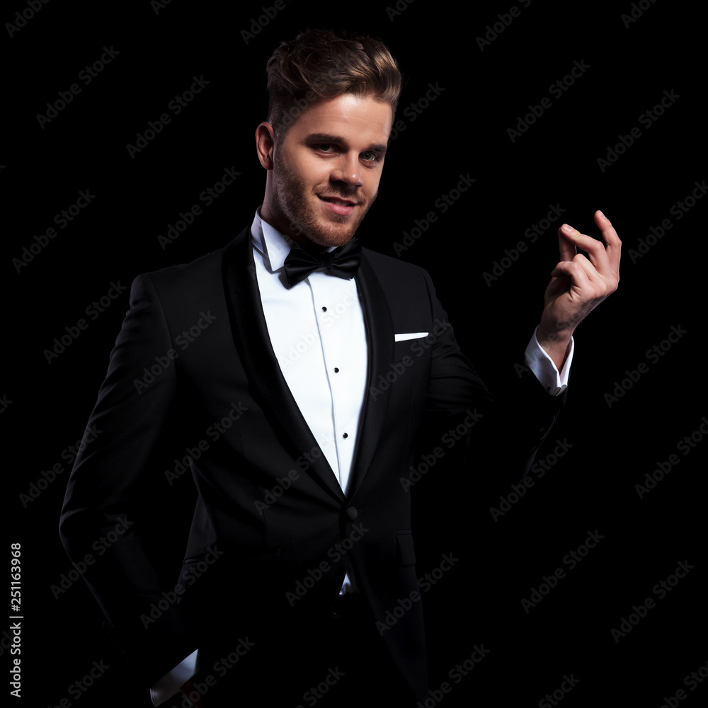 young elegant man snapping his fingers and smiling young elegant man snapping his fingers and smiling