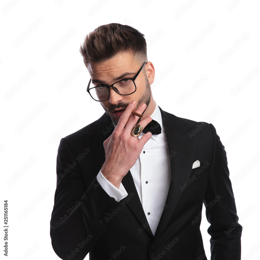 elegant man smoking a cigarette elegant man smoking a cigarette