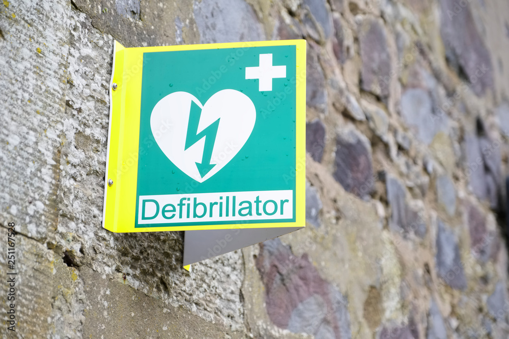 Defibrillator sign and symbol on wall Defibrillator sign and symbol on wall