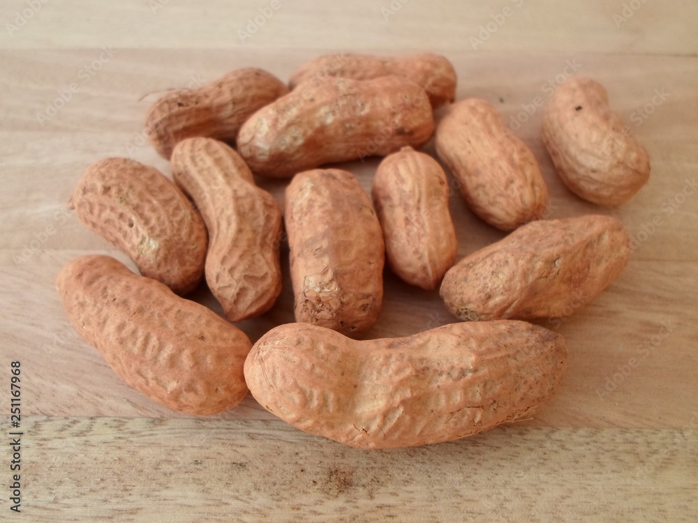Peanuts On Wooden Board Peanuts On Wooden Board