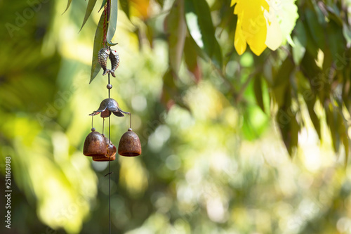 Closeup wind chimes in the garden for happiness, success, power, wealth.