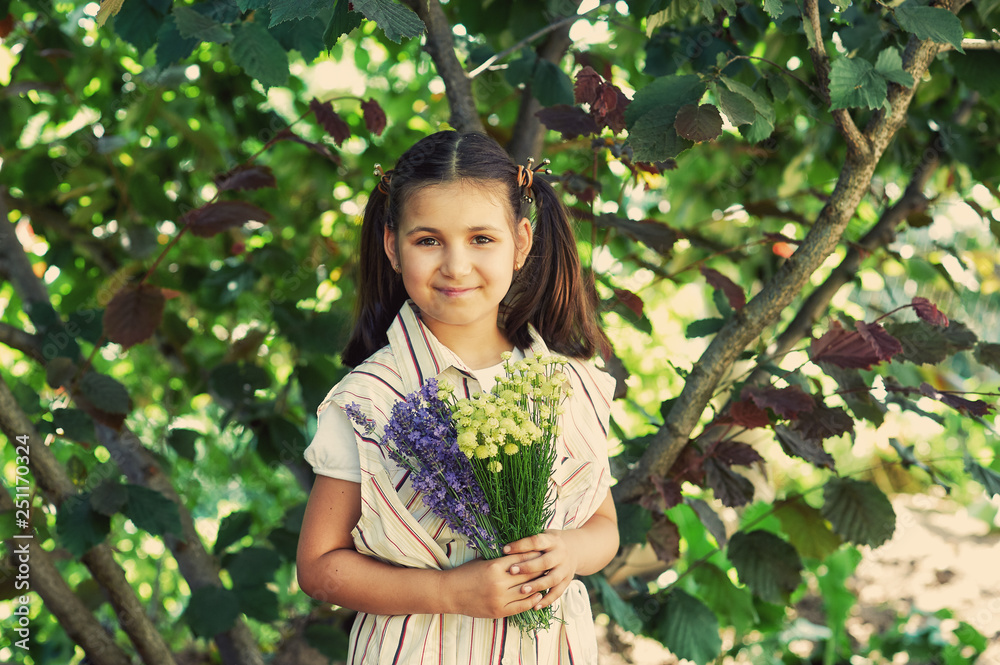 portrait of a little girl with wildflowers