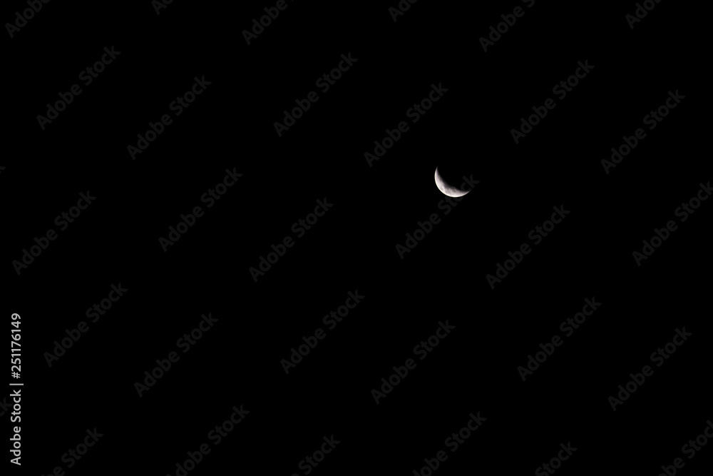 New moon. On the black sky. New moon. On the black sky.