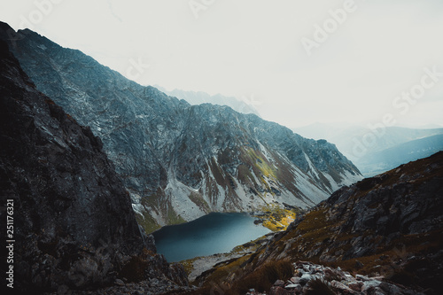 Obraz na płótnie A blue lake among high mountains w salonie