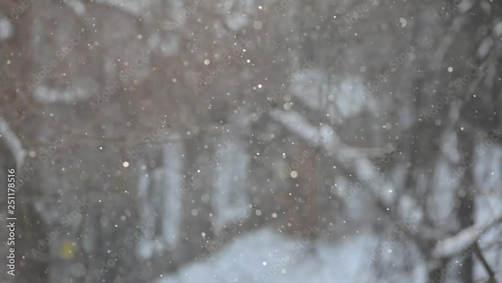 Blurred snowflakes in the window