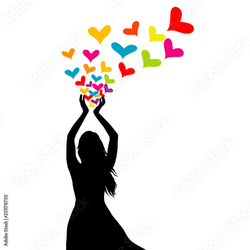 Silhouette of woman with colored hearts in her hands