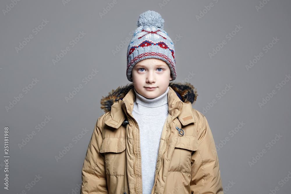 Fashionable Boy in winter outerwear. knitted hat Fashionable Boy in winter outerwear. knitted hat