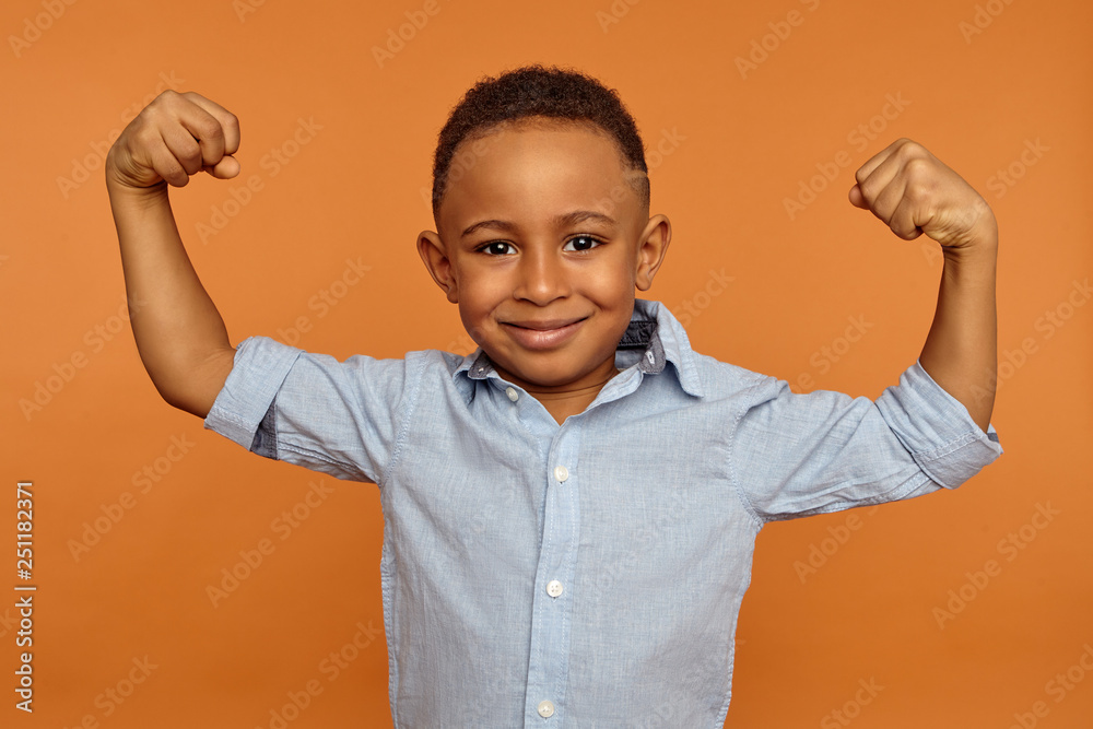 Body language. Horizontal shot of adorable cute African little boy