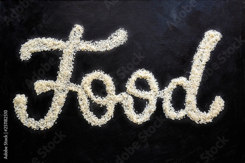 Food lettering rice on a black background poster.