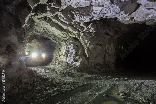 Underground gold ore mine shaft tunnel gallery passage with LHD machine