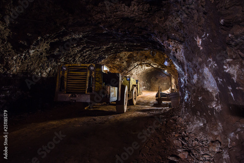 Underground gold ore mine shaft tunnel gallery passage with machine