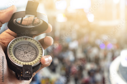 man holding compass on blurred background. for activity lifestyle