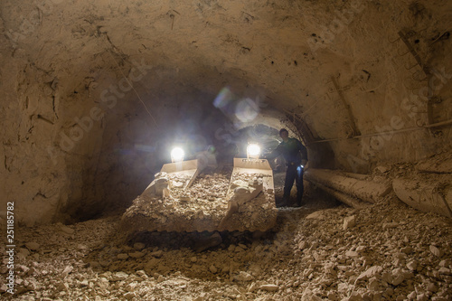 Underground gold ore mine shaft tunnel gallery passage with continious loader photo