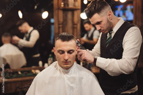 Professional barber make haircut © antgor