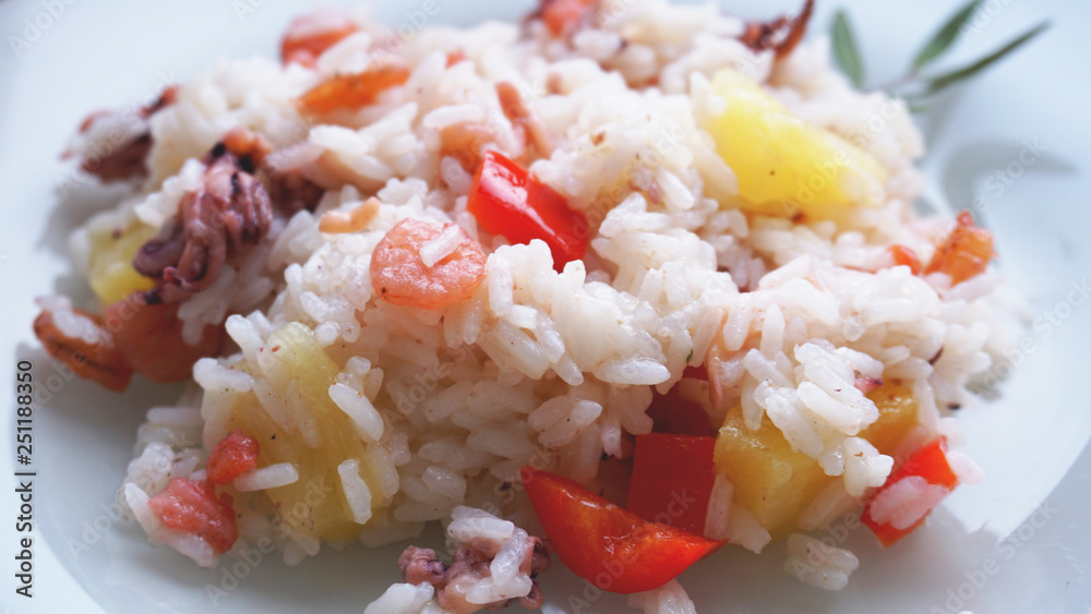 Rice with with shrimp and pineapple, thai or china food on white dish Rice with with shrimp and pineapple, thai or china food on white dish