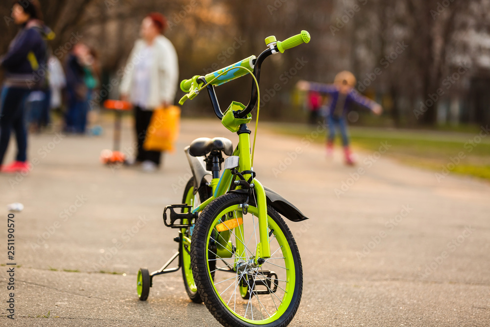 Fototapeta premium A bicycle with sunlight and green tree in park outdoor for background