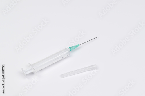 Single use syringe isolated on white