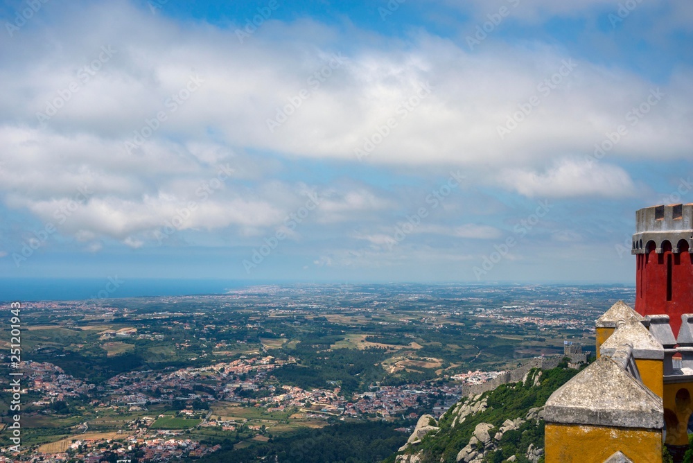 View of the valley, the city and the sky with clouds from the observation deck of the Pena Palace. Sintra, Portugal. View of the valley, the city and the sky with clouds from the observation deck of the Pena Palace. Sintra, Portugal.