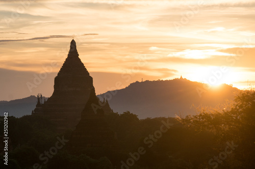 silhouette of pagoda by sunset at famous bagan field in myanmar