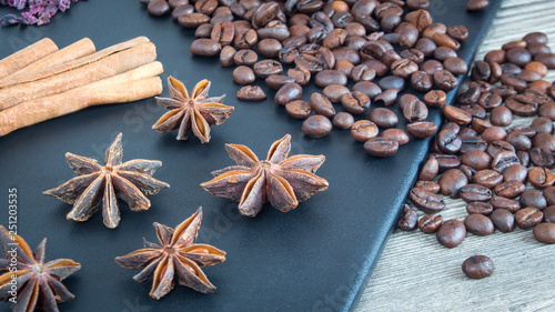Cinnamon sticks, star anise and coffee beans. Spices and food on wooden background. Ingredients for the restaurant