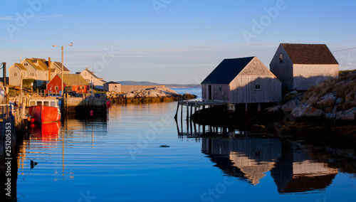 Fishing shacks, boat and buildings at iconic Peggys Cove, Nova Scotia, Canada.