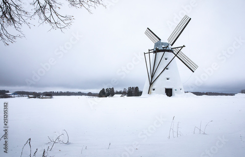 Windmill in Estonian winter landscape  photo