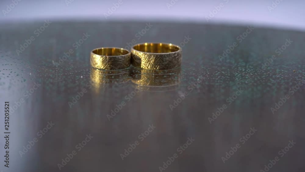 Golden rings for wedding at winter in snowly day Golden rings for wedding at winter in snowly day
