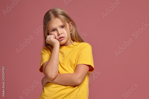 little girl in a yellow t-shirt. misses