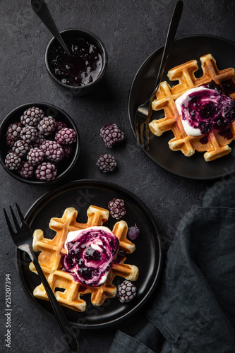 waffles with sour cream and berry sauce