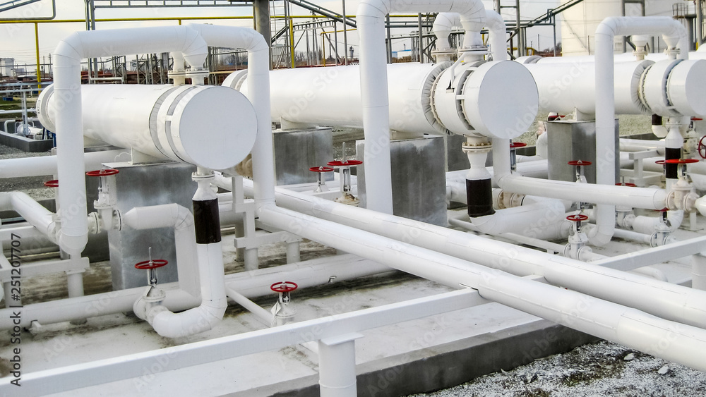 Heat exchangers in a refinery. The equipment for oil refining Heat exchangers in a refinery. The equipment for oil refining