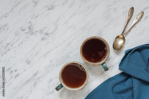 Two cups of black coffee an...