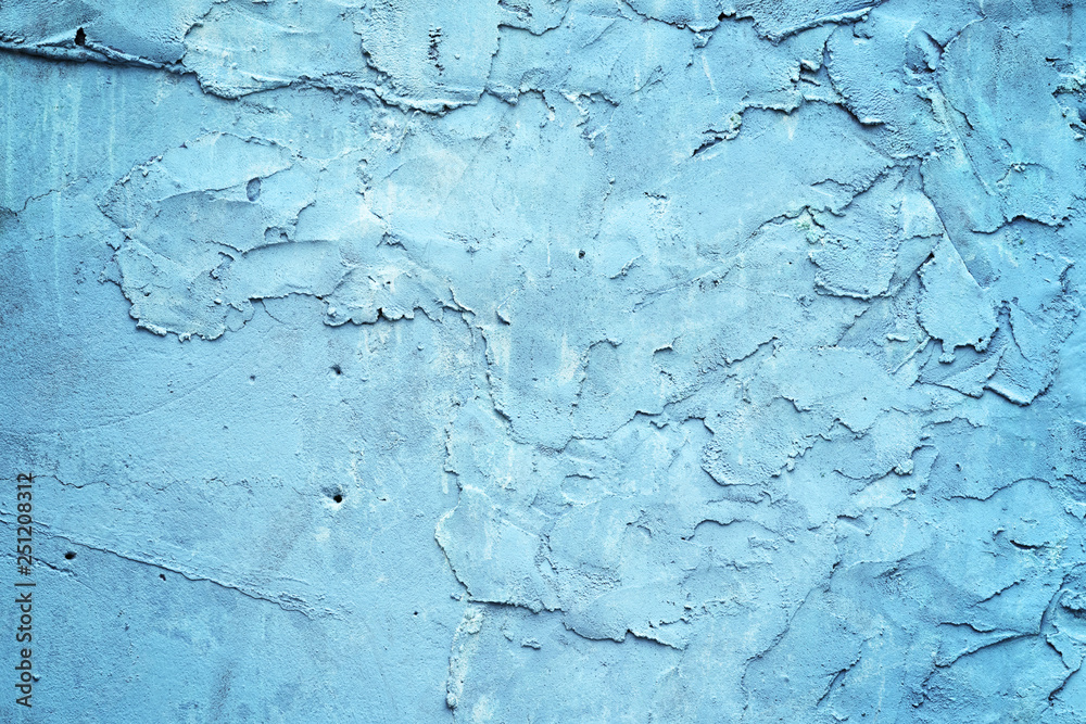 Grunge blue painted rough textured wall
