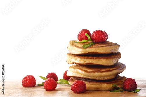  Pancakes. Homemade pancakes with raspberries on a wooden board.