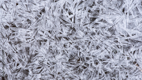 Ice crystals, close-up top view, background. Theme of winter and frost