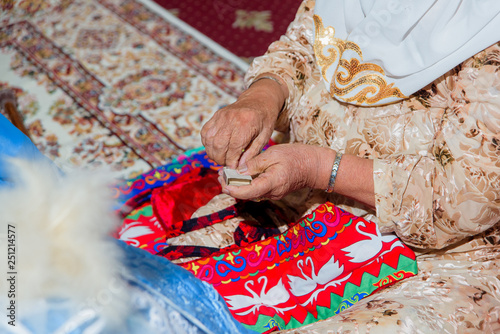 Kazakh national cradle. Customs and traditions. Wooden cradle. The ceremony of laying the child in the cradle. Lullaby matchmaking in Kazakhs. Kazakh cradle called: Besik. photo