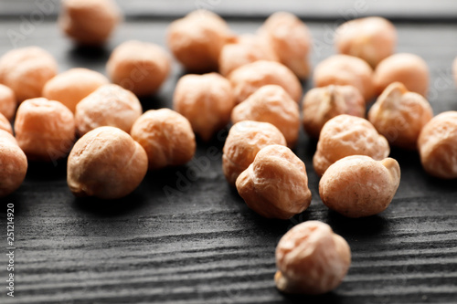 Chickpeas closeup on a black wooden background