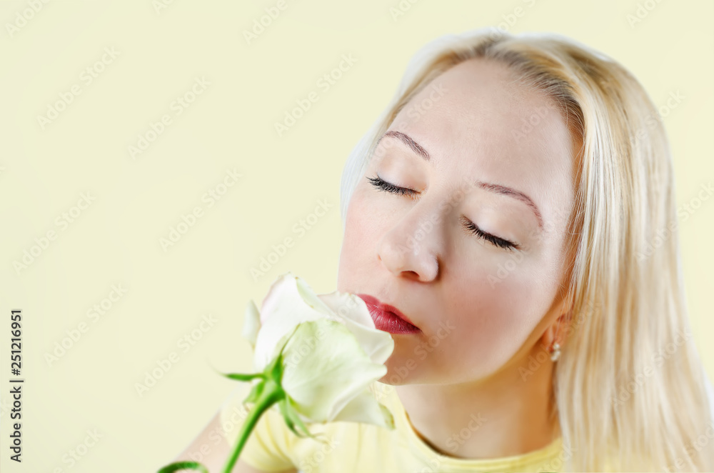 Beautiful young woman with a flower
