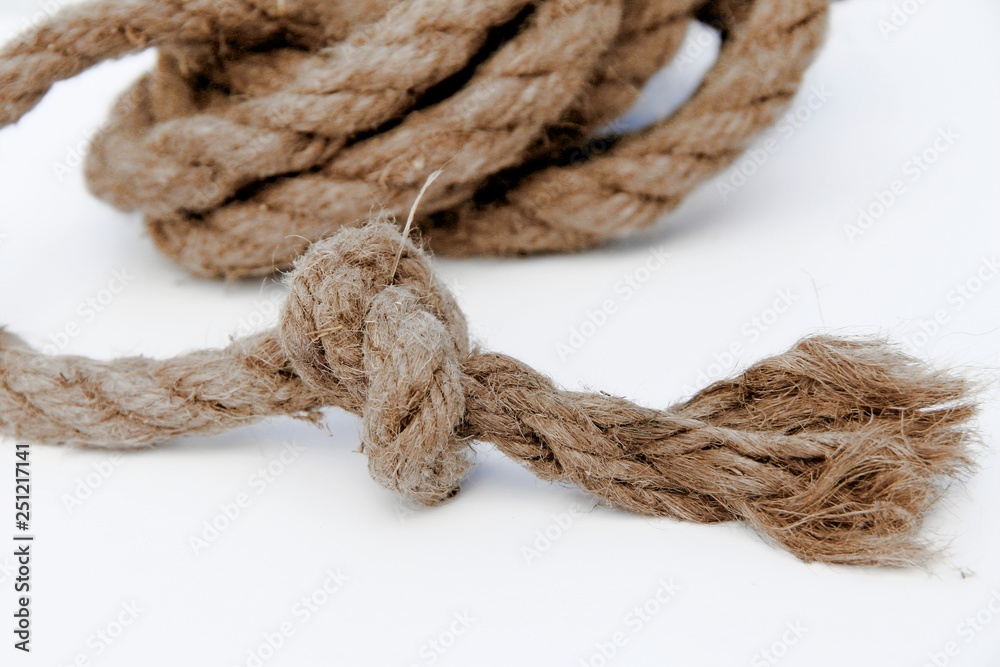 Rope with a knot is on a white background.