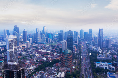 Jakarta cityscape with skyscrapers at misty morning © Creativa Images