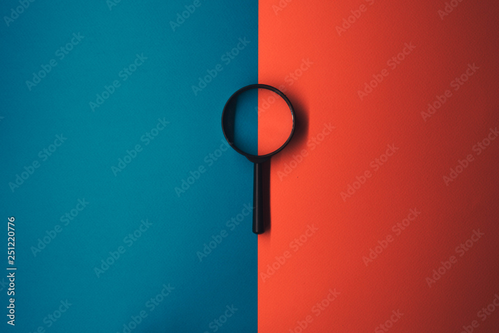 magnifying glass magnifying glass red and blue background ภาพถ่ายสต็อก