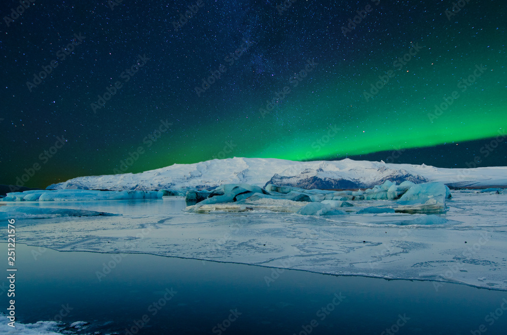 Frozen wonderland in scenic Iceland, with starry sky and northern lights
