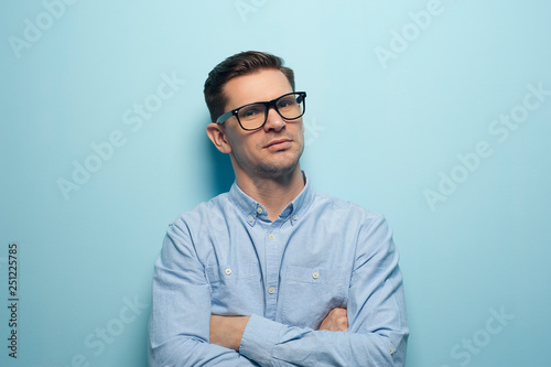 Young handsome businessman in formal wear and glasses