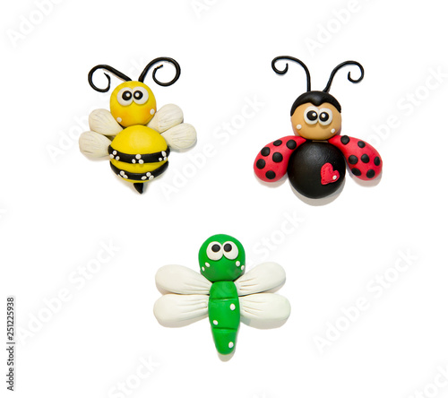 modeling clay beetles, insects, on a white background. Funny plasticine beetles. Bee, coccinella, dragonfly from plastic