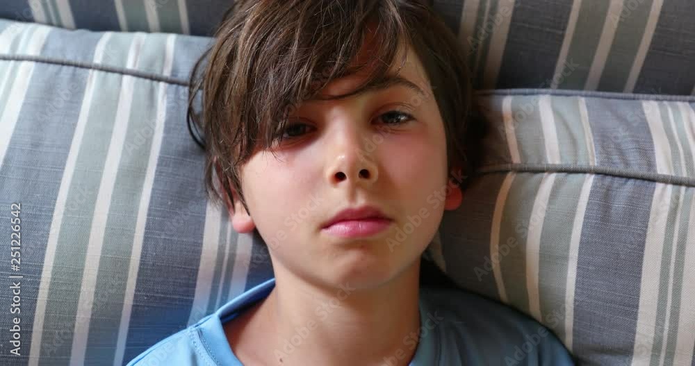 Portrait of young handsome boy child looking at camera