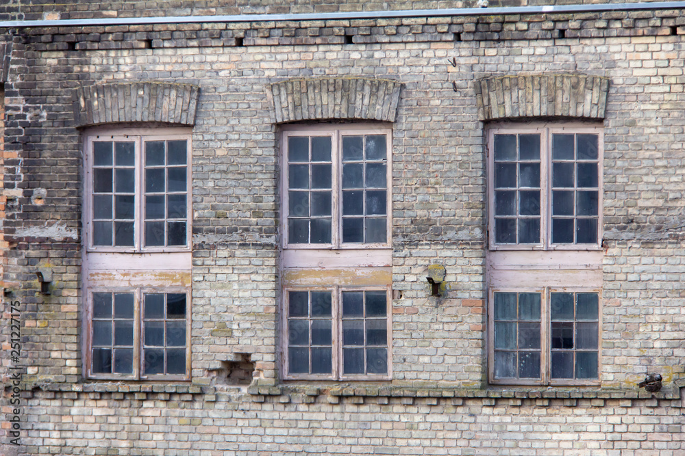 Old wooden Windows of an old brick house