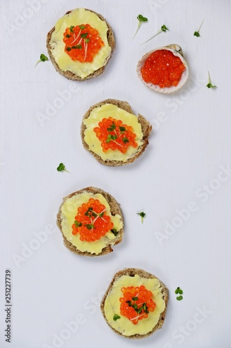 Caviar sandwiches isolated on white