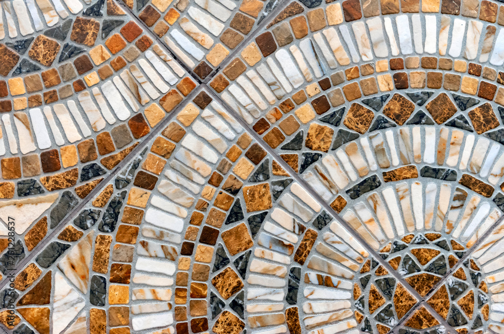 Porcelain stonewear tile of a multi-colored mosaic.