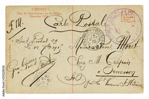 Back of historical French postcard. Beautiful calligraphic handwriting, the text of the letter is written in black ink with curls. Postmark cancellation,  world war one 1915. France
