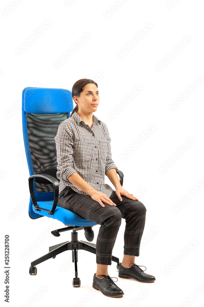 Woman sitting on the office chair and doing exercises. Woman sitting on the office chair and doing exercises.
