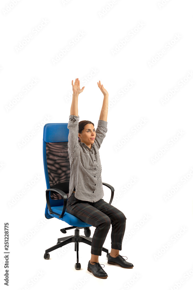 Woman sitting on the office chair and doing exercises. Woman sitting on the office chair and doing exercises.